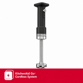KitchenAid hand blender with a black handle and silver metallic base, shown on a white background with a red KitchenAid Go cordless system banner at the bottom.